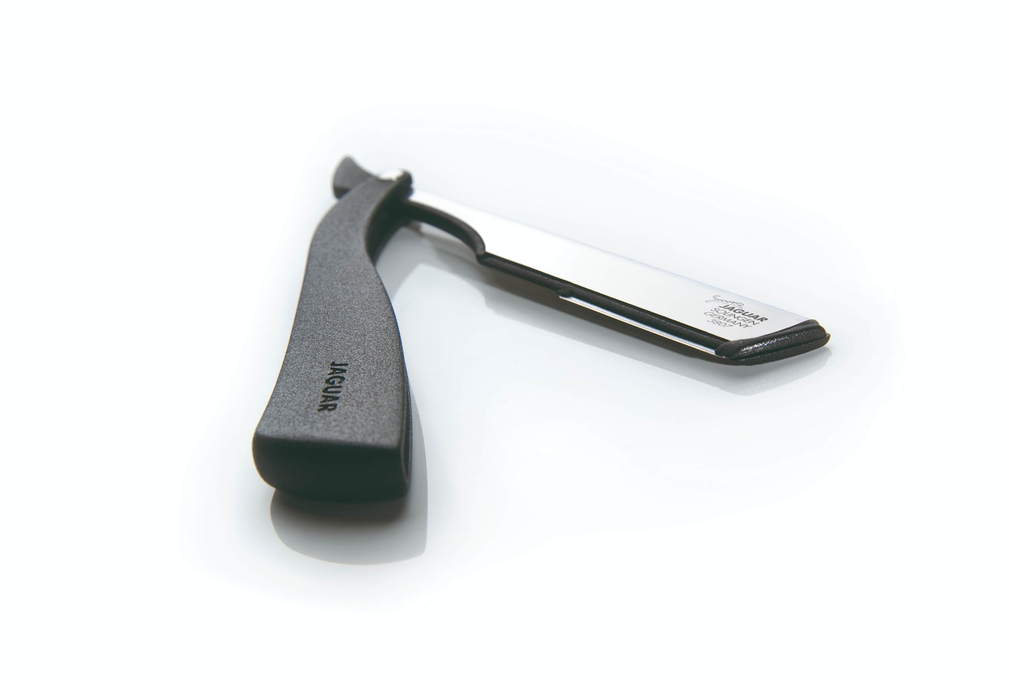 Straight razor with black handle.