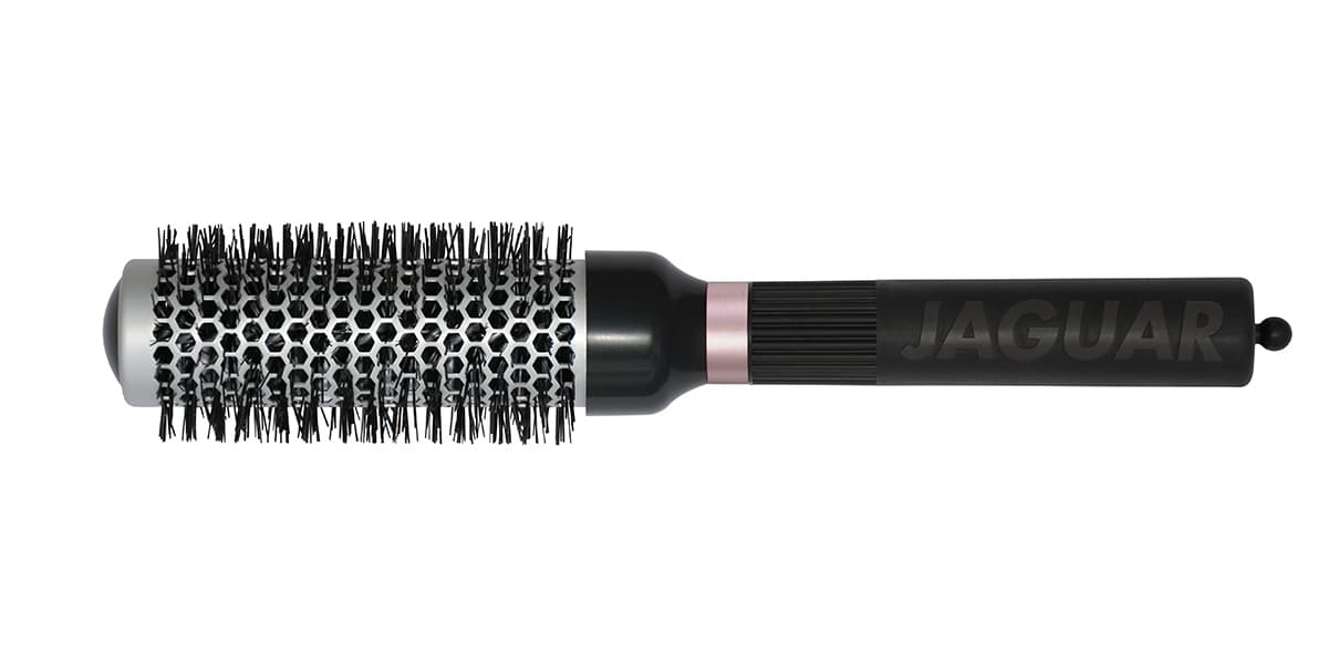 Round brush with black handle.