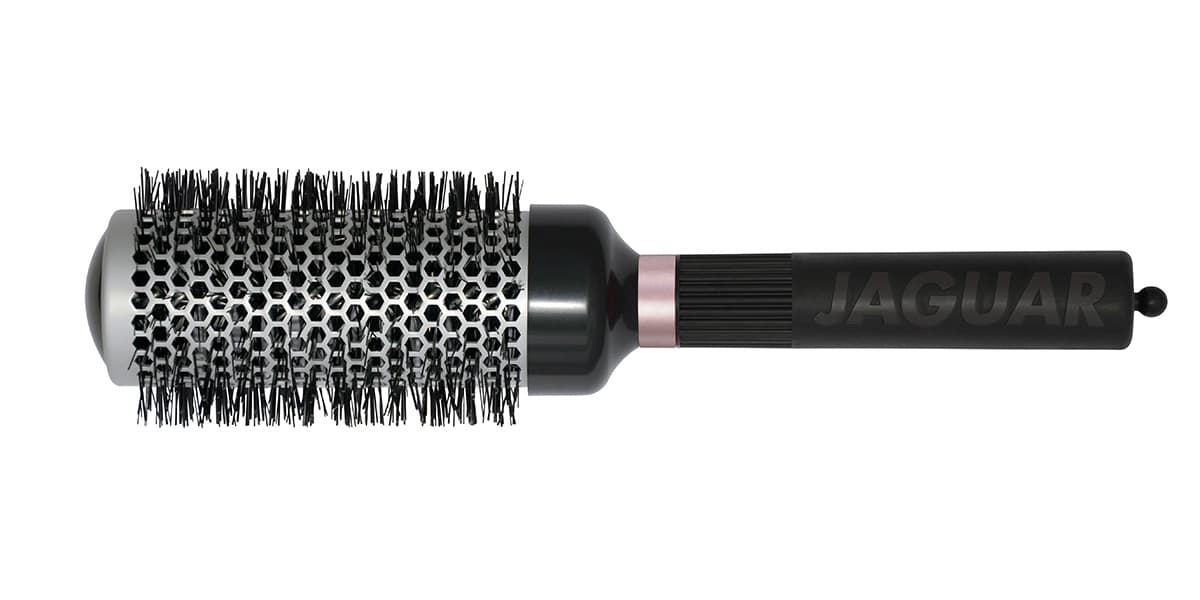 Round brush with black handle.