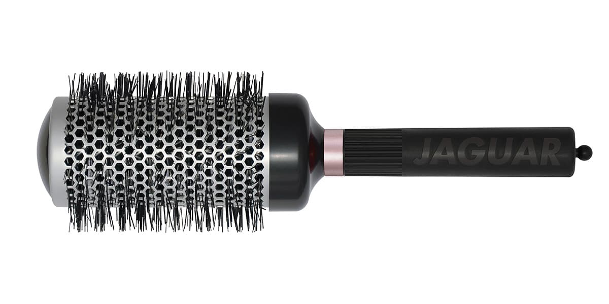 Round brush with black handle.