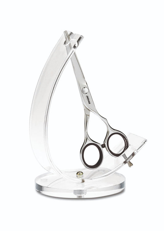 Scissors in transparent display holder.