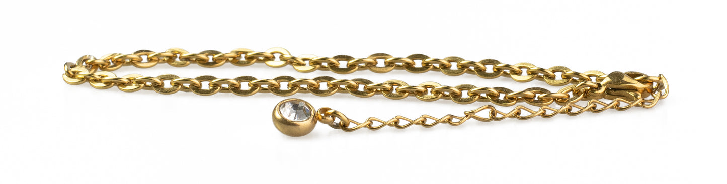 Golden hairdressing scissors with an ergonomic design.