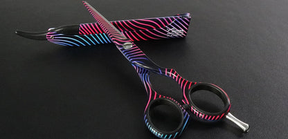 Hairdressing scissors with colorful pattern.