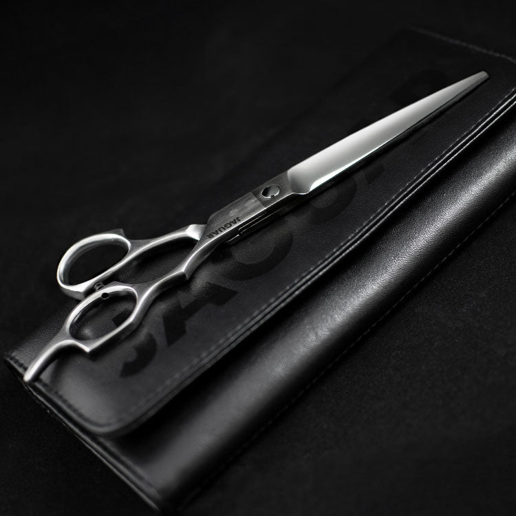 Black Line scissors Black Line pencil case on black background.