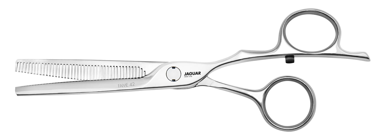 Hairdressing scissors with serrated blades.