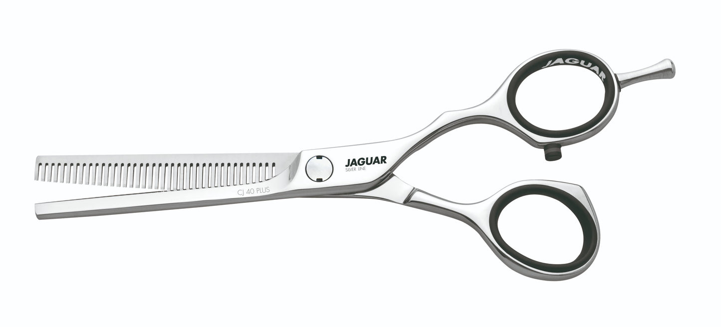Hairdressing scissors with serrated blades.
