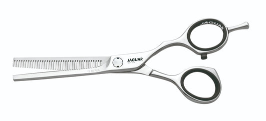 Hairdressing scissors with serrated blades.