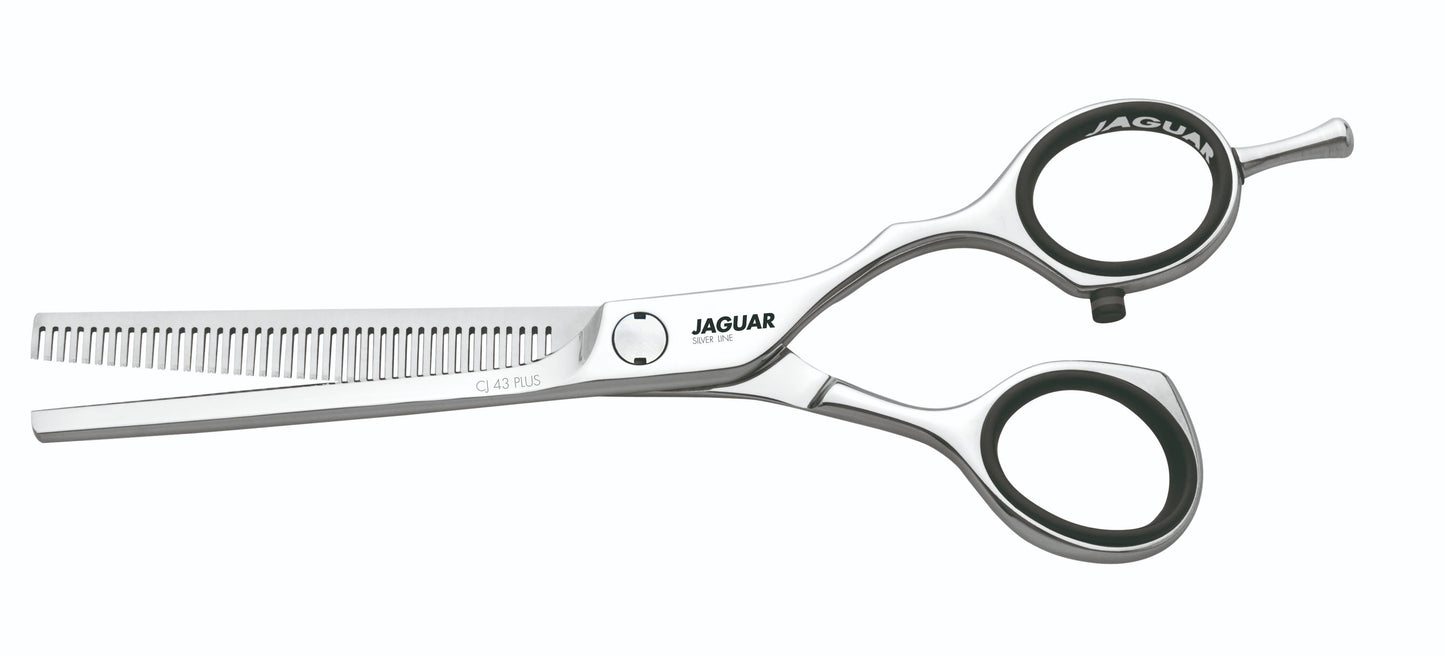 Hairdressing scissors with serrated blades.