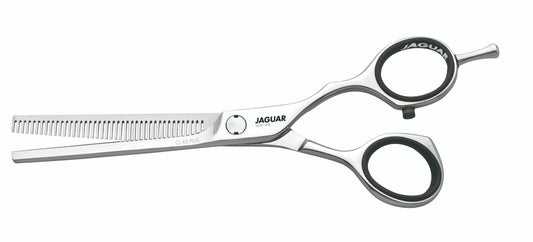 Hairdressing scissors with serrated blades.