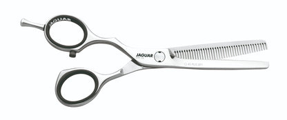 Hairdressing scissors with serrated blades.