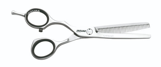 Hairdressing scissors with serrated blades.