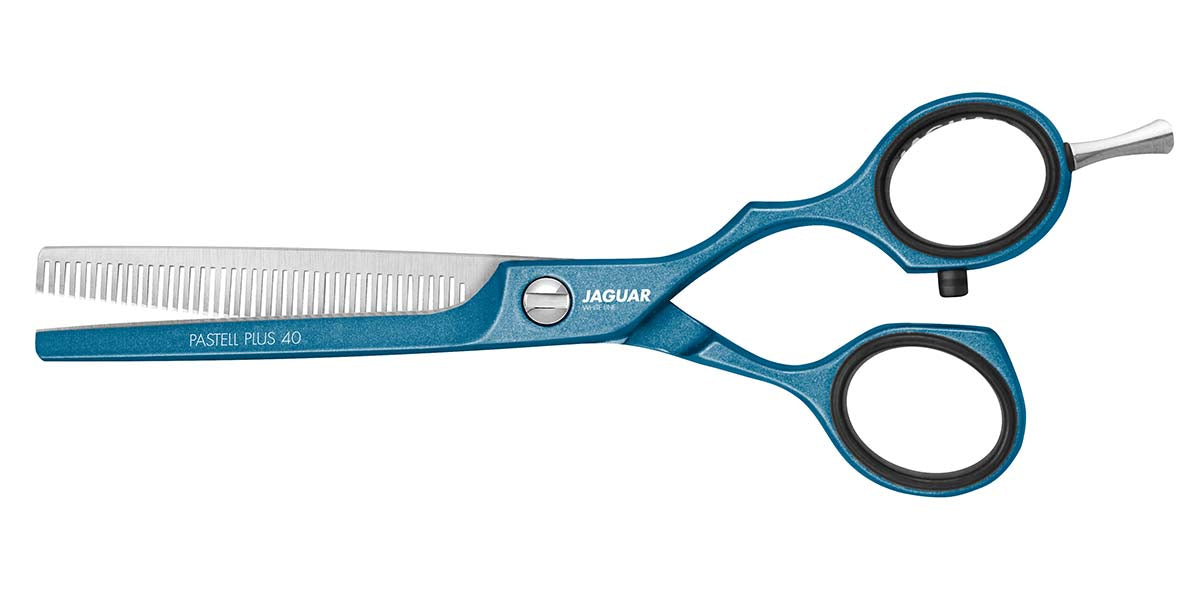 Modeling scissors with blue handle.
